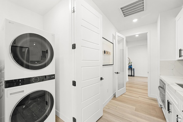 578 S Cecita Way Unit 91, St George, UT 84770 - laundry area featuring stacked washer / drying machine, recessed lighting, and light wood-style floors