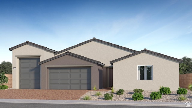 578 S Cecita Way Unit 91, St George, UT 84770 - ranch-style house featuring a garage, driveway, stucco siding, and a tiled roof