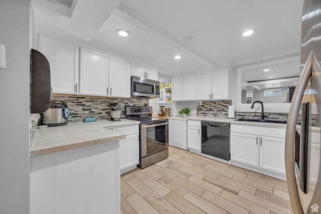 4682 S 475 W, Washington Terrace, UT 84405 - kitchen with appliances with stainless steel finishes, backsplash, recessed lighting, white cabinets, and light countertops
