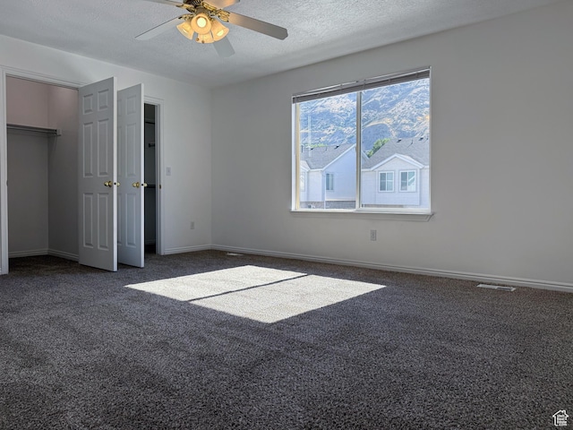 1356 S 1400 E, Provo, UT 84606 - unfurnished bedroom with carpet, a textured ceiling, and a ceiling fan