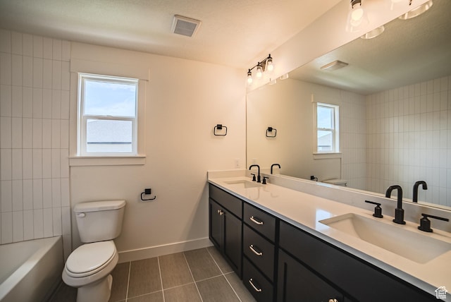 10942 S Samoa Dune Dr, South Jordan, UT 84009 - full bathroom featuring double vanity, healthy amount of natural light, tile patterned flooring, and shower / washtub combination