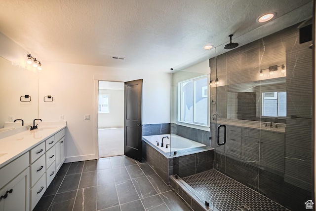 10942 S Samoa Dune Dr, South Jordan, UT 84009 - full bath featuring double vanity, a shower stall, a bath, a textured ceiling, and tile patterned floors