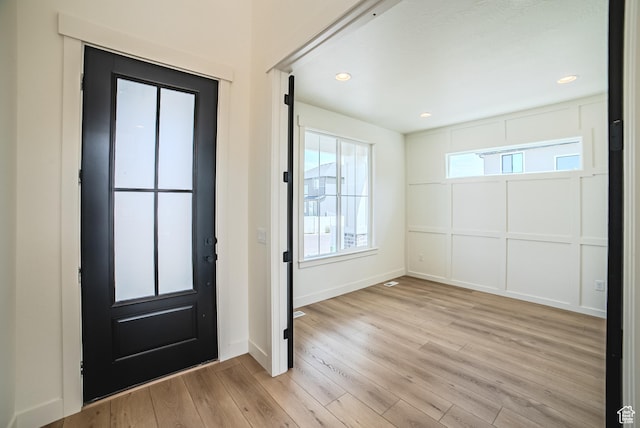 10942 S Samoa Dune Dr, South Jordan, UT 84009 - entryway with light wood finished floors, recessed lighting, and a decorative wall