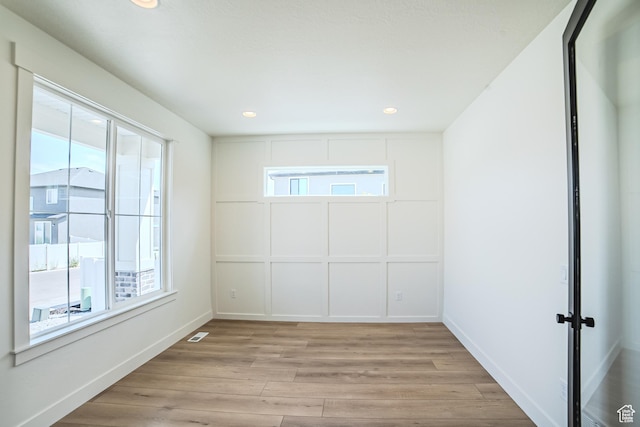 10942 S Samoa Dune Dr, South Jordan, UT 84009 - empty room featuring light wood finished floors and recessed lighting