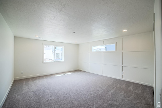 10942 S Samoa Dune Dr, South Jordan, UT 84009 - carpeted spare room featuring plenty of natural light, a textured ceiling, and recessed lighting