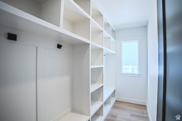 10942 S Samoa Dune Dr, South Jordan, UT 84009 - mudroom featuring light wood-style floors and baseboards