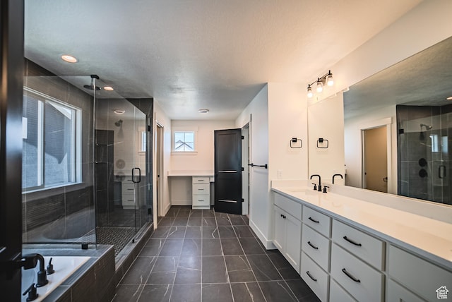10942 S Samoa Dune Dr, South Jordan, UT 84009 - bathroom featuring vanity, a shower stall, a bath, tile patterned flooring, and a textured ceiling