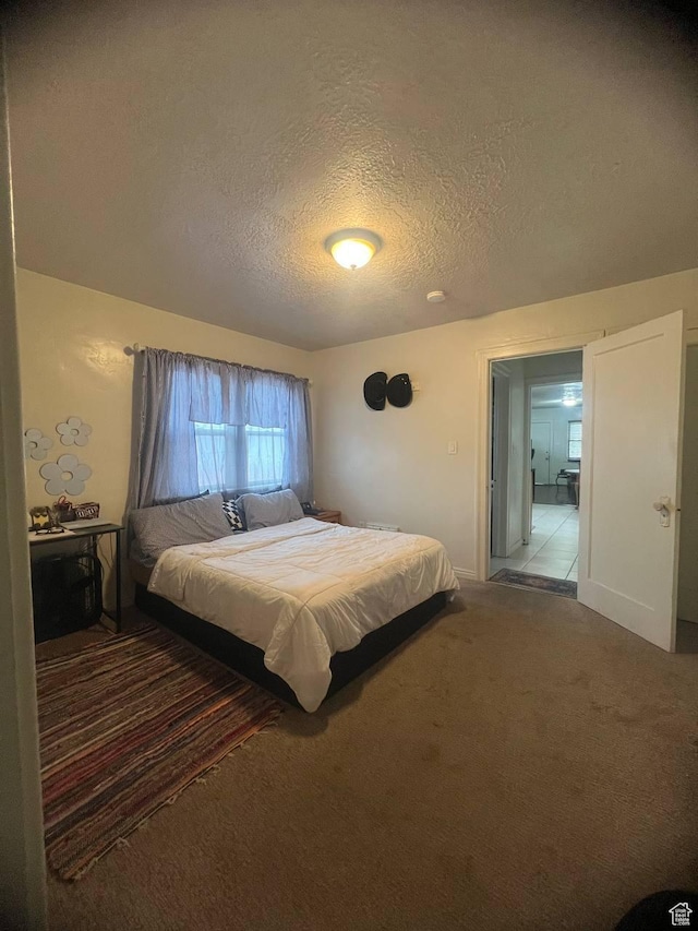 7659 S Lincoln St, Midvale, UT 84047 - bedroom with a textured ceiling and carpet flooring