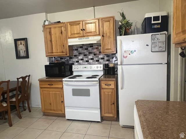 7659 S Lincoln St, Midvale, UT 84047 - kitchen with white appliances, under cabinet range hood, dark countertops, light tile patterned floors, and decorative backsplash