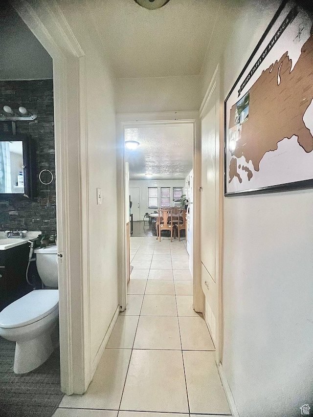 7659 S Lincoln St, Midvale, UT 84047 - corridor with light tile patterned floors and a textured ceiling