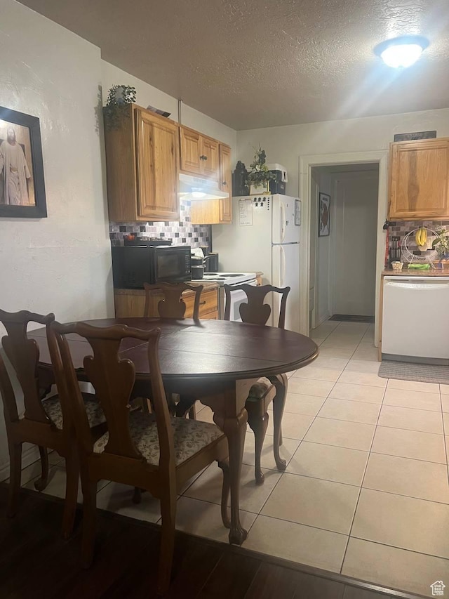 7659 S Lincoln St, Midvale, UT 84047 - dining space featuring a textured ceiling and light tile patterned floors