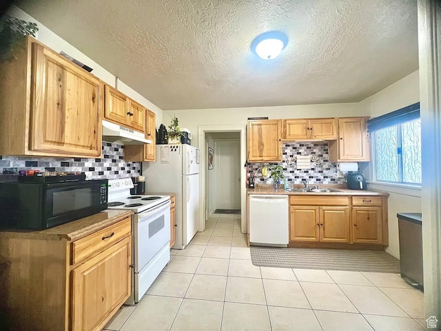 7659 S Lincoln St, Midvale, UT 84047 - kitchen with white appliances, under cabinet range hood, backsplash, a textured ceiling, and light tile patterned flooring