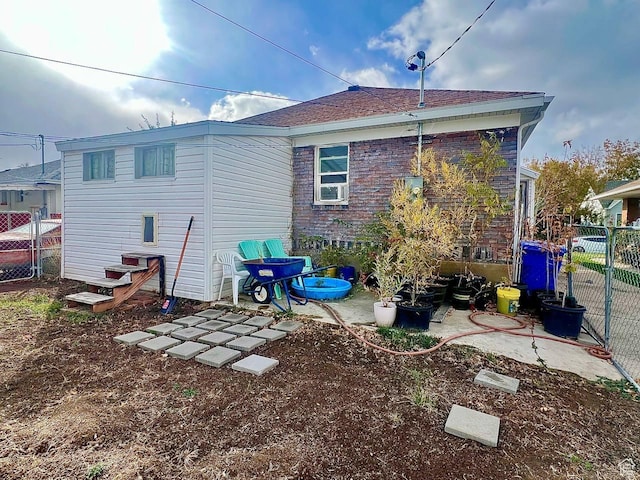 7659 S Lincoln St, Midvale, UT 84047 - rear view of property featuring roof with shingles and a patio area