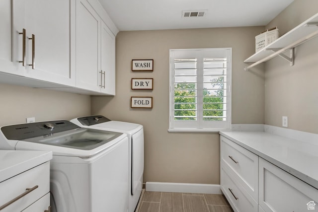 6063 S Kamas Dr W, Taylorsville, UT 84129 - laundry area with cabinet space, washer and dryer, and wood finish floors