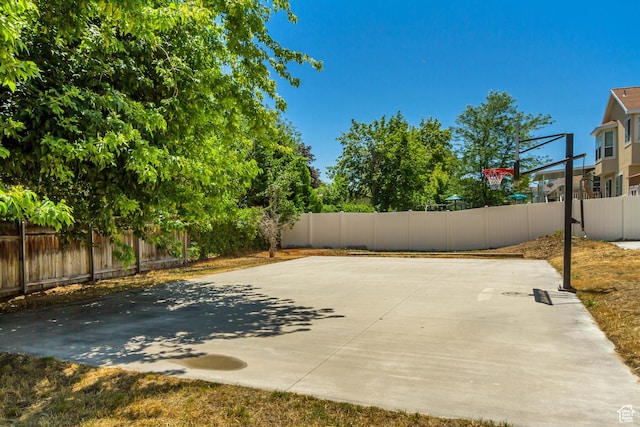 6063 S Kamas Dr W, Taylorsville, UT 84129 - fenced backyard with basketball hoop