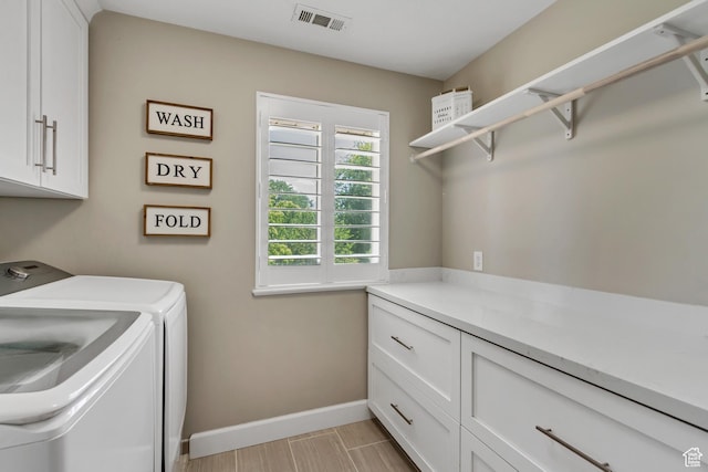 6063 S Kamas Dr W, Taylorsville, UT 84129 - washroom with cabinet space and washer and dryer