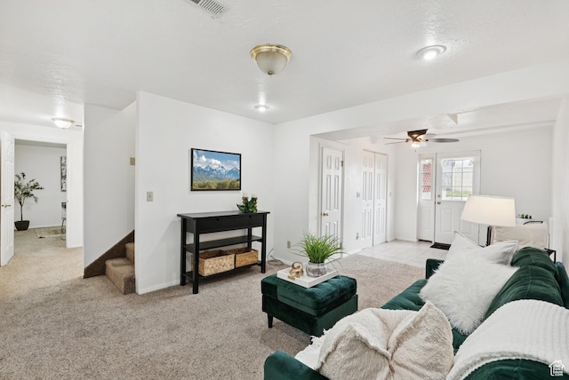 1074 E Spring Ridge Dr, Sandy, UT 84094 - living area with ceiling fan, light carpet, and stairs