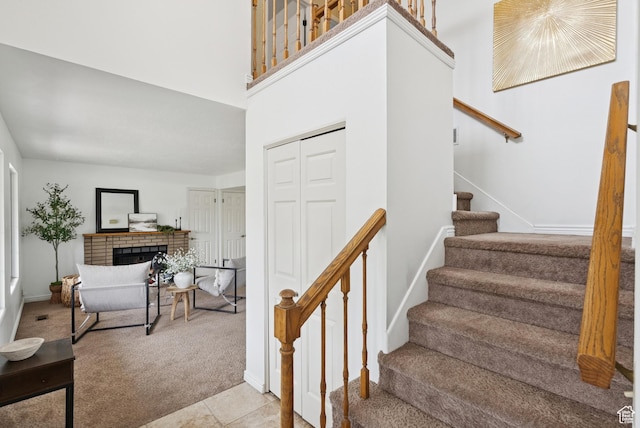 1074 E Spring Ridge Dr, Sandy, UT 84094 - stairs with carpet and a fireplace