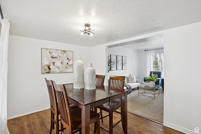 1074 E Spring Ridge Dr, Sandy, UT 84094 - dining area with a chandelier, wood finished floors, and a textured ceiling