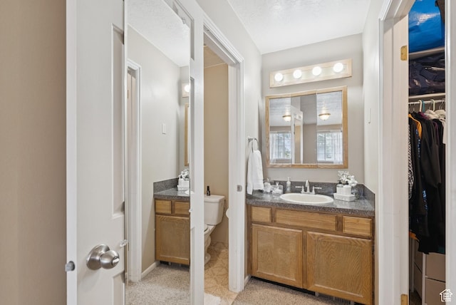 1074 E Spring Ridge Dr, Sandy, UT 84094 - bathroom featuring vanity and a walk in closet