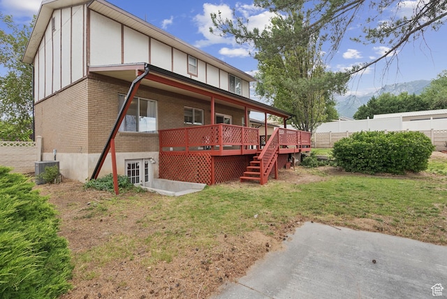 1074 E Spring Ridge Dr, Sandy, UT 84094 - back of property with brick siding and a deck