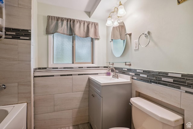 601 E Hilo St S, Sandy, UT 84070 - full bath with tile walls, vanity, shower / washtub combination, and wainscoting