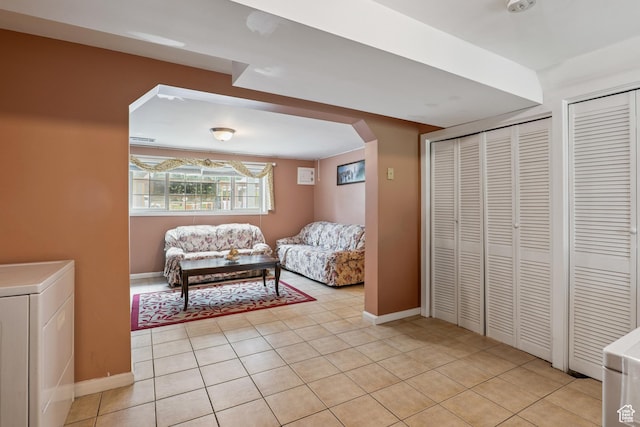 601 E Hilo St S, Sandy, UT 84070 - living area with arched walkways, washer / dryer, and light tile patterned flooring