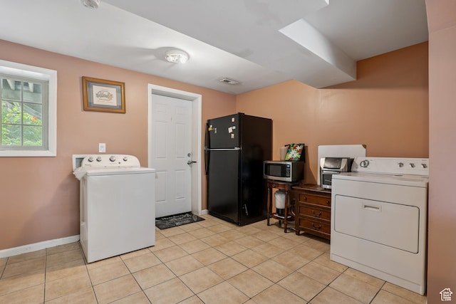 601 E Hilo St S, Sandy, UT 84070 - laundry room featuring washer / clothes dryer and light tile patterned floors