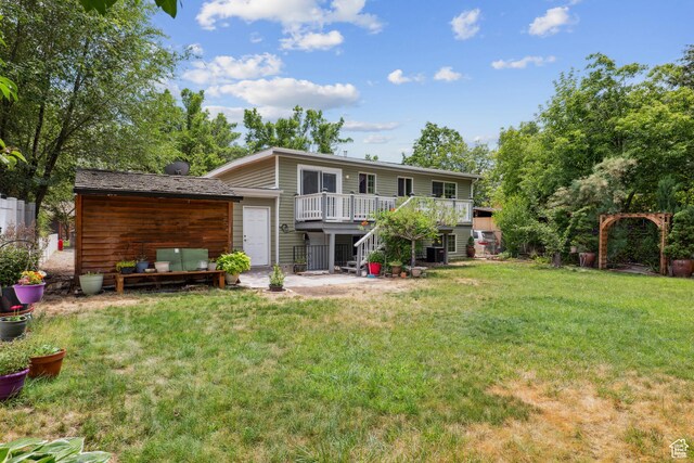 601 E Hilo St S, Sandy, UT 84070 - rear view of property featuring a wooden deck, stairs, and a yard
