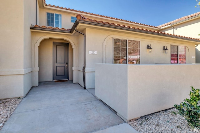 1210 N Mistico Aly, Washington, UT 84780 - property entrance featuring stucco siding and a tiled roof