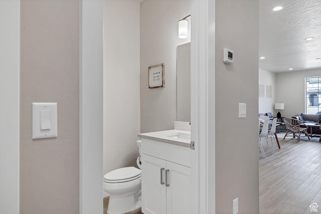 1210 N Mistico Aly, Washington, UT 84780 - bathroom with vanity, recessed lighting, and wood finished floors