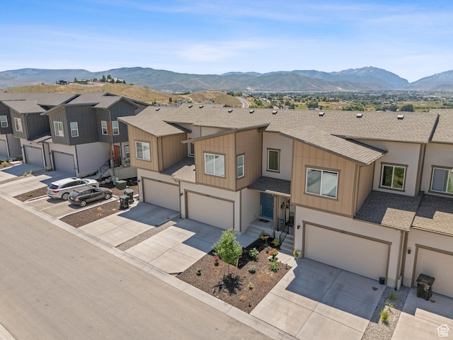 2309 N Wildwood Ln, Heber City, UT 84032 - townhome / multi-family property with a garage, driveway, board and batten siding, and roof with shingles