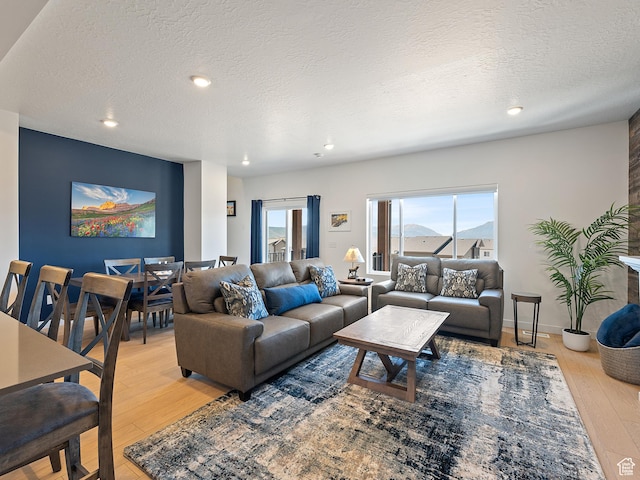 2309 N Wildwood Ln, Heber City, UT 84032 - living area with a textured ceiling, light wood-style flooring, and recessed lighting