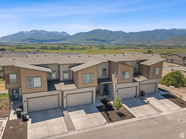 2309 N Wildwood Ln, Heber City, UT 84032 - view of front facade with an attached garage, driveway, and a mountain view
