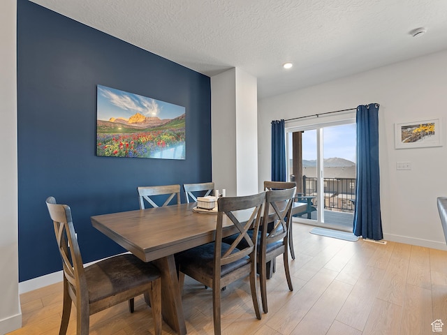 2309 N Wildwood Ln, Heber City, UT 84032 - dining space featuring light wood-style floors, a textured ceiling, and recessed lighting