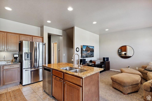 164 S 2875 W, West Point, UT 84015 - kitchen featuring appliances with stainless steel finishes, open floor plan, light stone counters, recessed lighting, and an island with sink