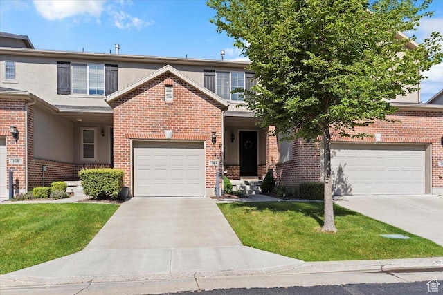 164 S 2875 W, West Point, UT 84015 - traditional-style house featuring concrete driveway, brick siding, a front lawn, a garage, and stucco siding