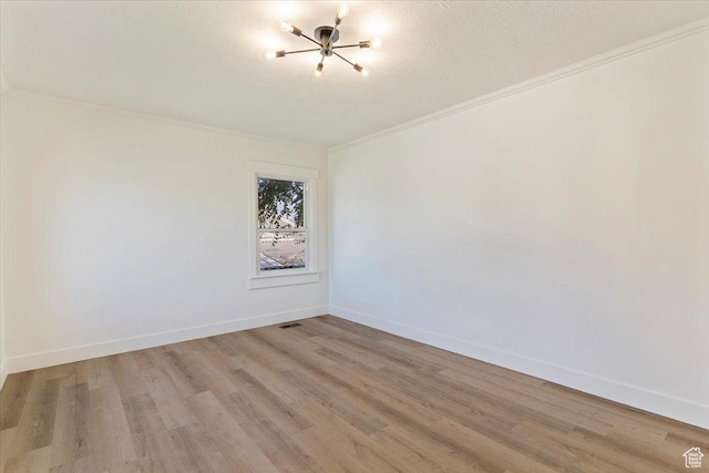 178 Country Club Dr, South Ogden, UT 84405 - empty room with crown molding, light wood-style floors, and a chandelier