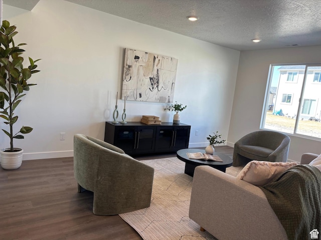 1536 E Pheasant Rd Unit 214, Eagle Mountain, UT 84005 - living room with wood finished floors, a textured ceiling, and recessed lighting