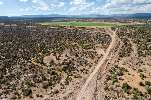 170 S 20300 W, Duchesne, UT 84021 - aerial view of sparsely populated area featuring a mountain backdrop and property parcel outlined