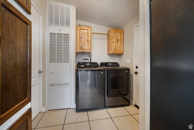 170 S 20300 W, Duchesne, UT 84021 - laundry area with cabinet space, a heating unit, washing machine and dryer, and light tile patterned floors