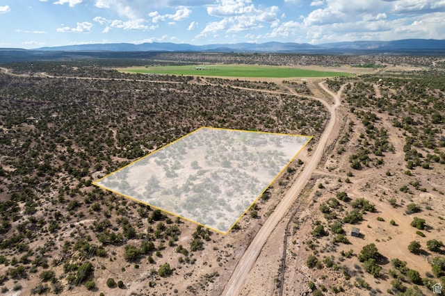 170 S 20300 W, Duchesne, UT 84021 - aerial view of property and surrounding area featuring a mountain backdrop and property boundaries highlighted