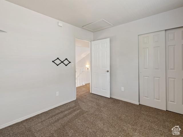 466 E 3460 N, North Ogden, UT 84414 - unfurnished bedroom with carpet, a closet, and attic access
