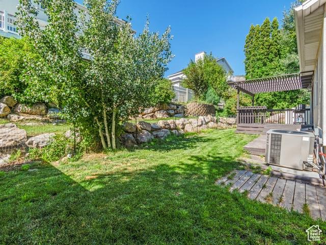466 E 3460 N, North Ogden, UT 84414 - view of grassy yard with a deck and a pergola