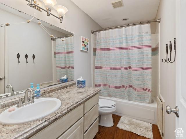 466 E 3460 N, North Ogden, UT 84414 - full bath with vanity, shower / bath combination with curtain, and wood finished floors