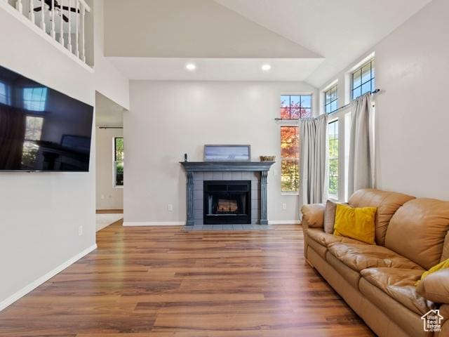 466 E 3460 N, North Ogden, UT 84414 - living room with high vaulted ceiling, wood finished floors, a fireplace, and recessed lighting