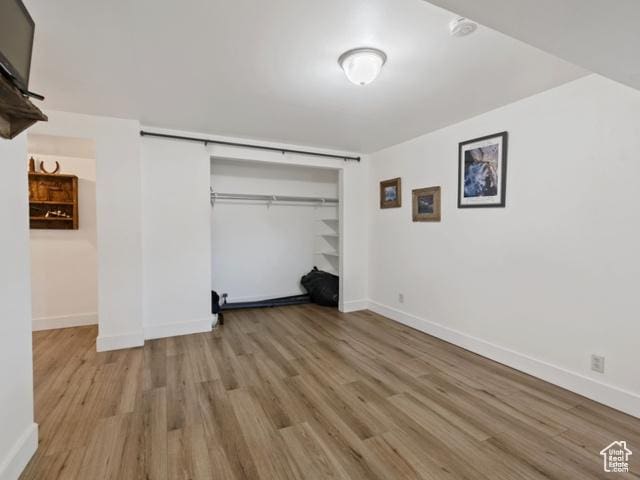 466 E 3460 N, North Ogden, UT 84414 - unfurnished bedroom featuring wood finished floors and a closet
