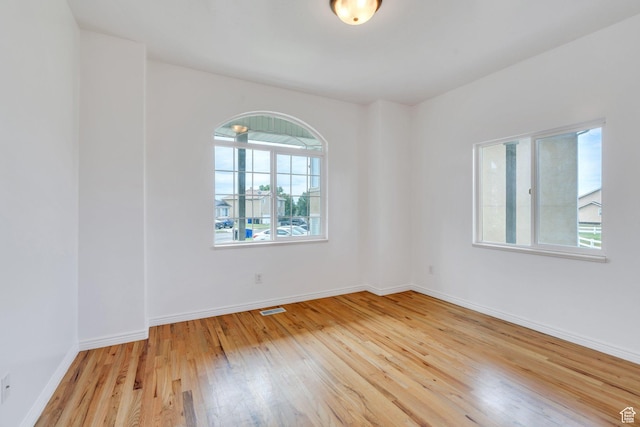 1430 S Heather Ln, Syracuse, UT 84075 - spare room featuring light wood-style floors and baseboards