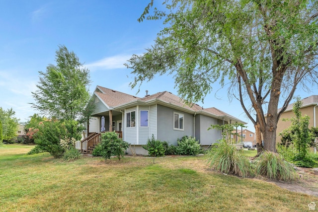 1430 S Heather Ln, Syracuse, UT 84075 - view of side of home featuring a lawn and stucco siding