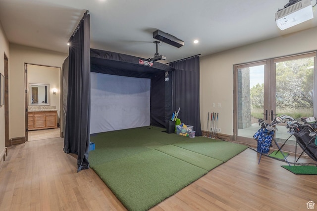 223 N Ibapah Peak Dr, Heber City, UT 84032 - recreation room featuring golf simulator, light wood finished floors, french doors, and recessed lighting